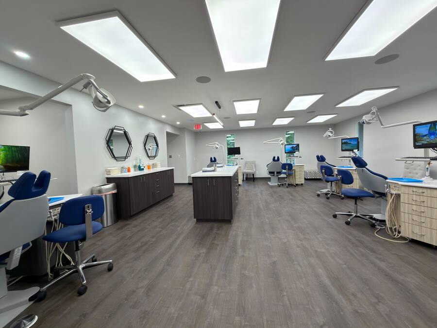 Open orthodontic treatment bay with blue chairs at the Beloit office
