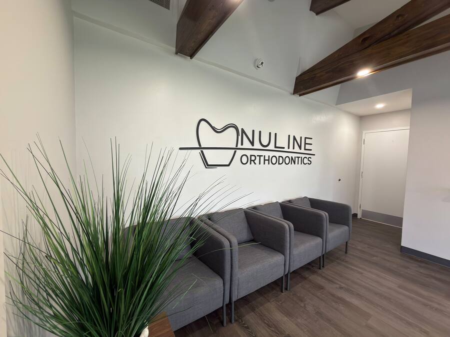 NuLine Orthodontics logo wall above the seating in the Beloit lobby